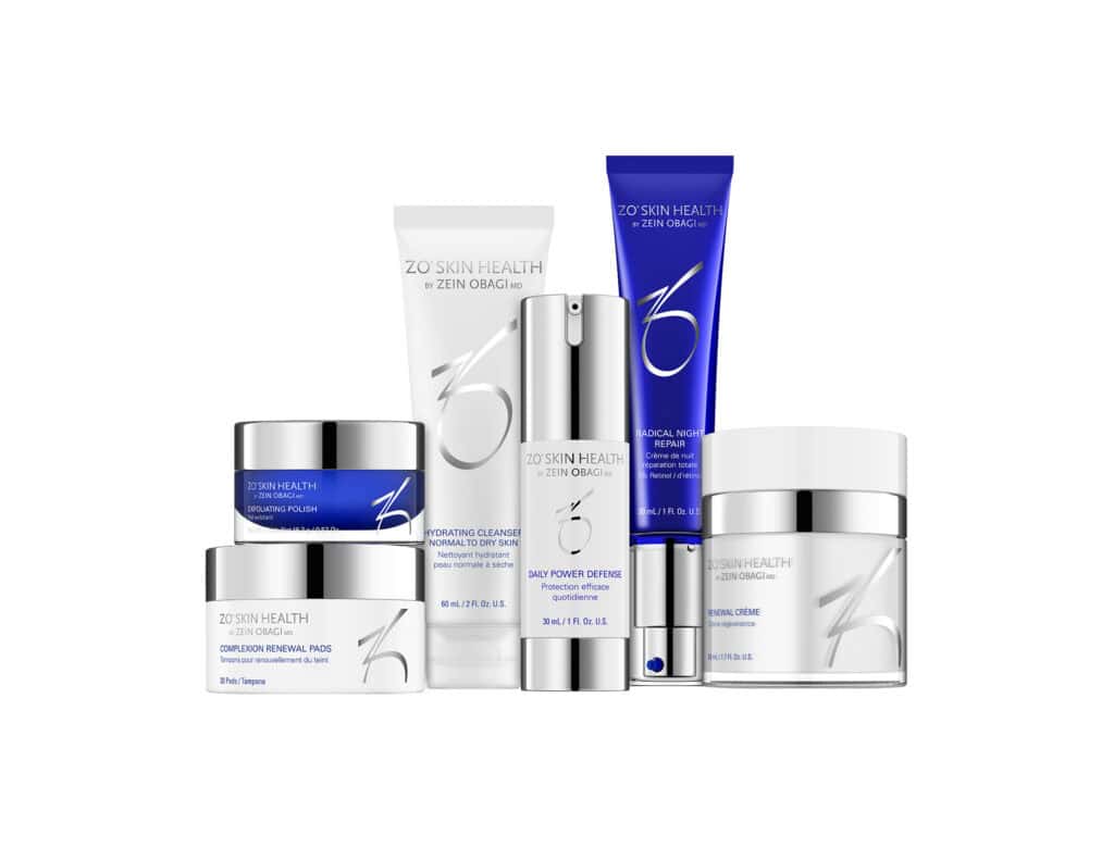 ZO Skin Health products arranged upright, featuring creams, a tube, and a pump bottle on a white background.