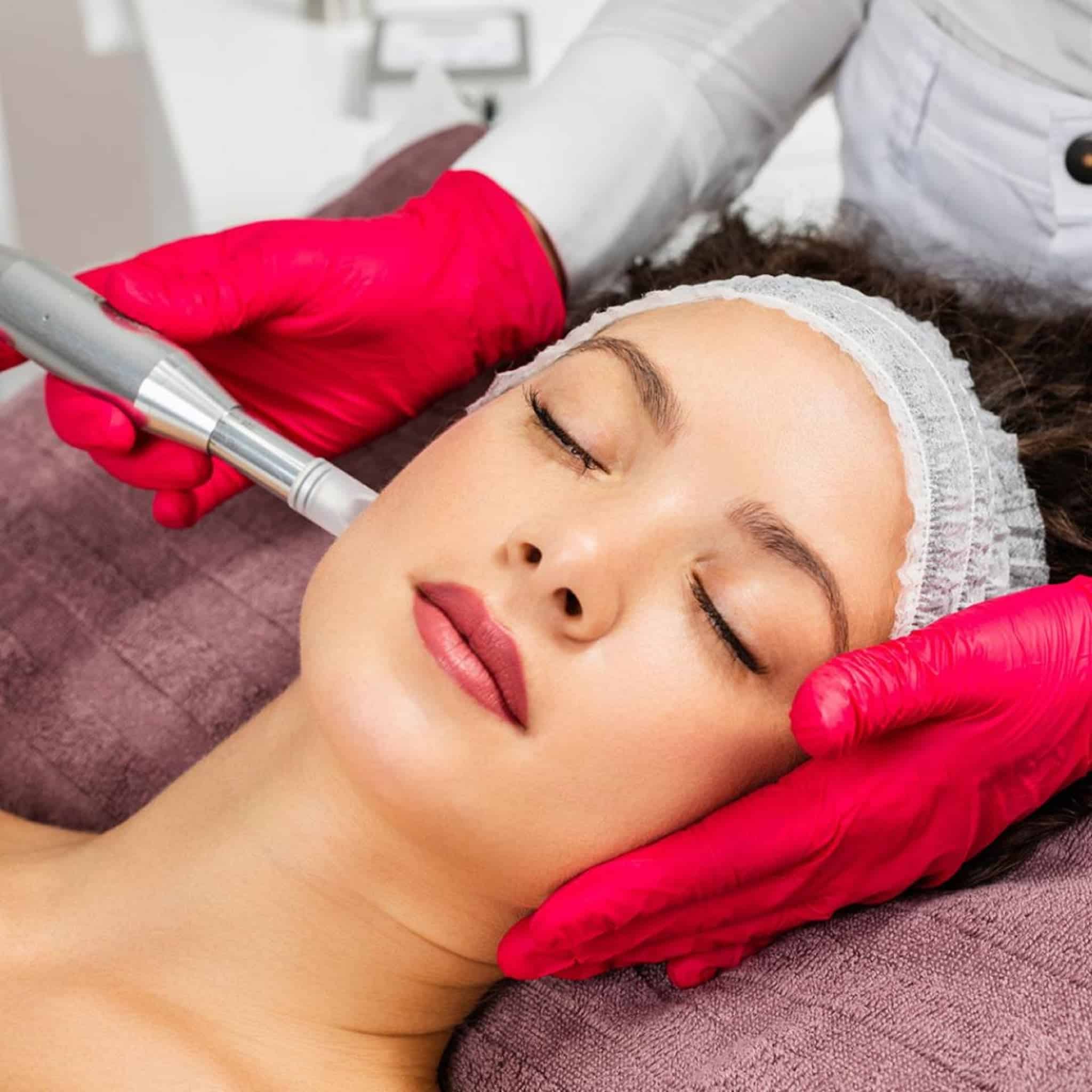 Woman receives a face massage at an Anchorage spa, a soothing finish after getting laser hair removal in Anchorage.